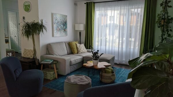 a living room filled with furniture and a large window